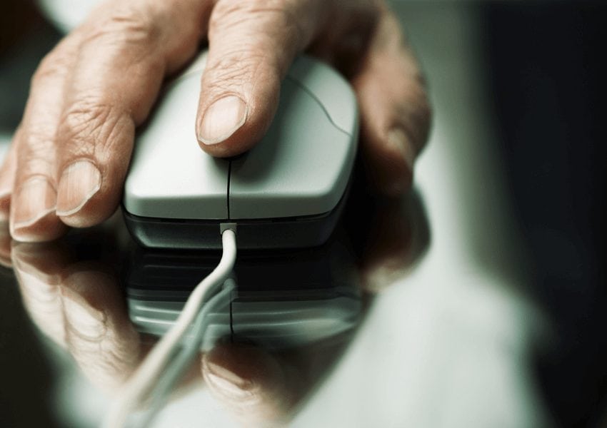 Hand using a wired mouse