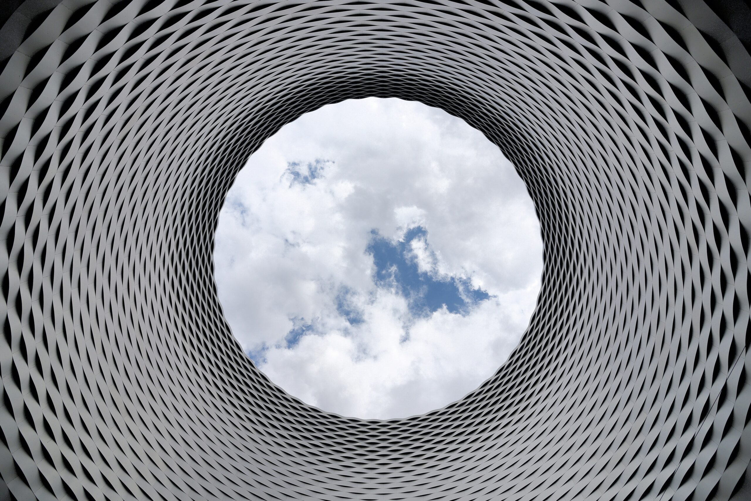 Abstract metal mandala, with sky in centre