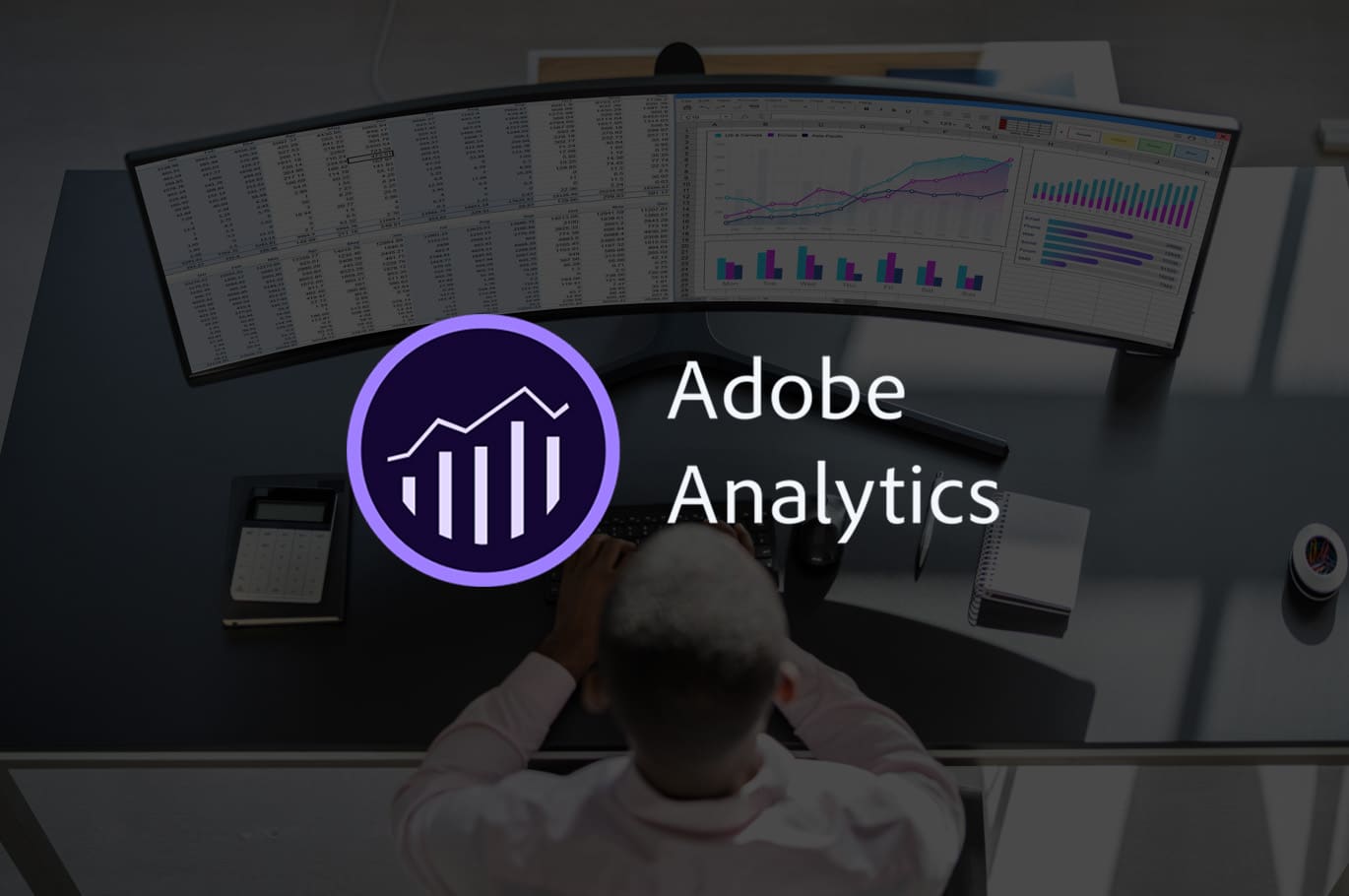 Adobe analytics logo with background of man working on monitor