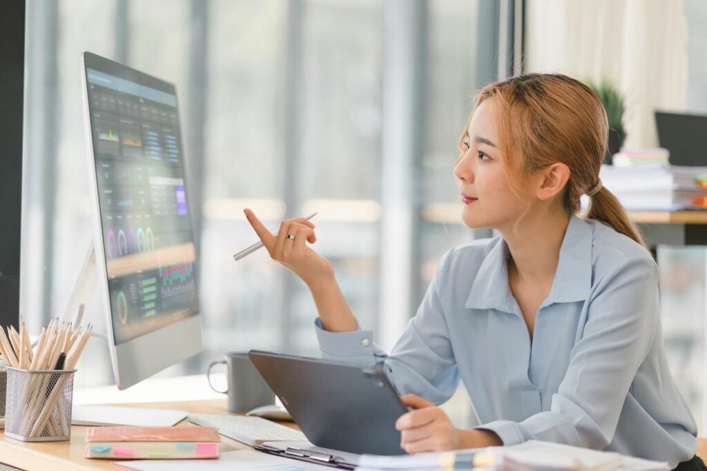 women checking analytics on monitor